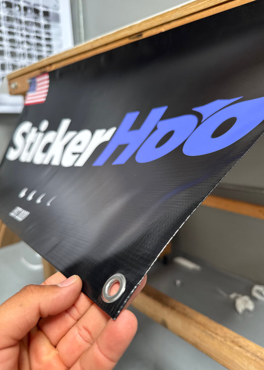 Person Holding Grommet corner of a Vinyl Banner branded StickerHoo 