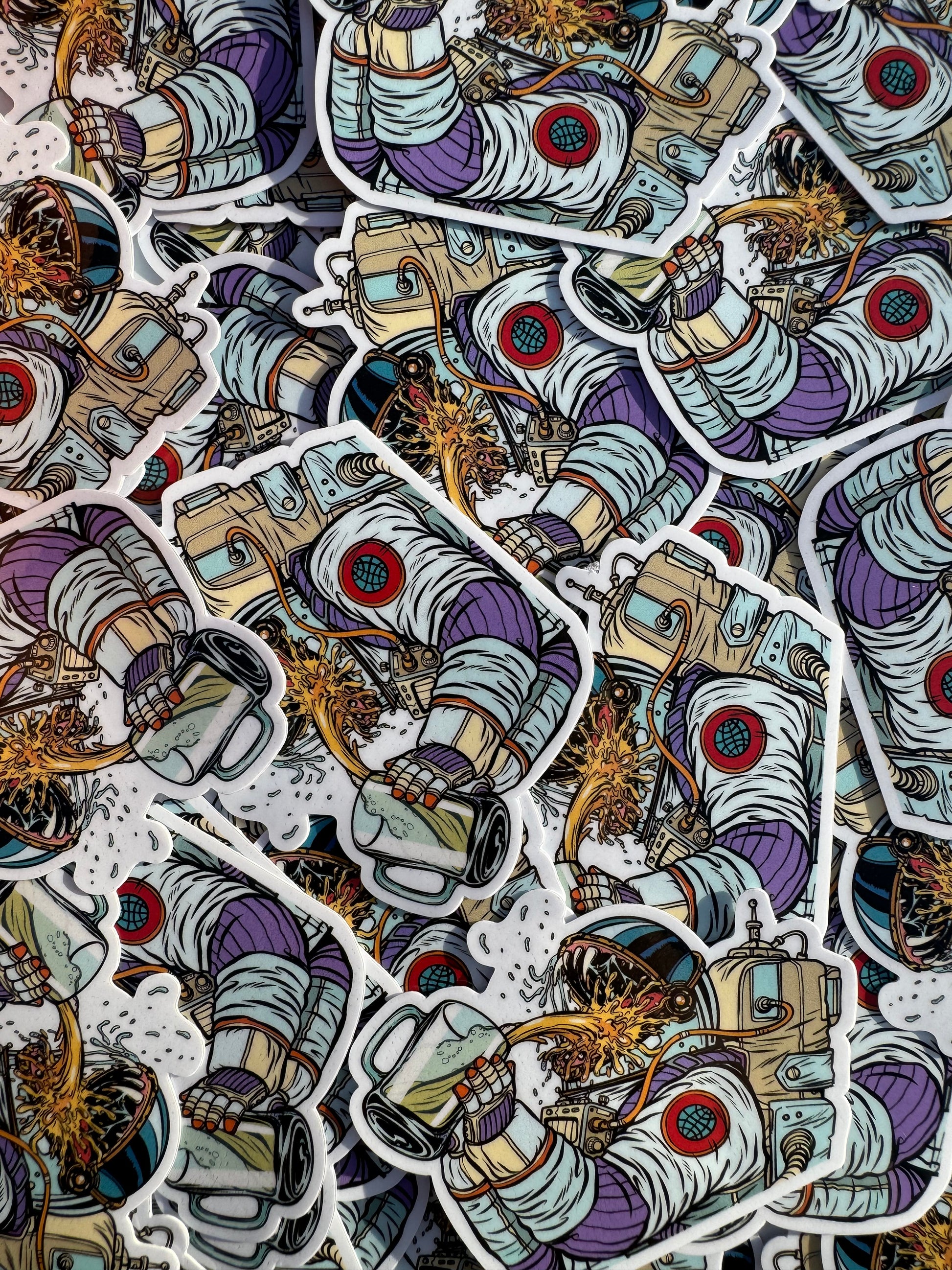 stickers of a spaceman drinking beer